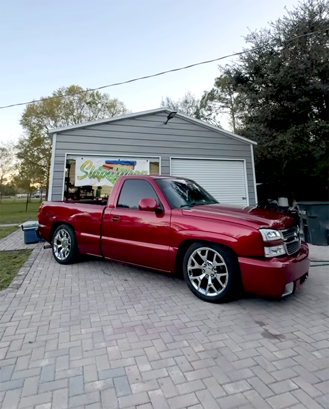 GalleryImage1 Close-up of a custom color change wrap being applied to a vehicle