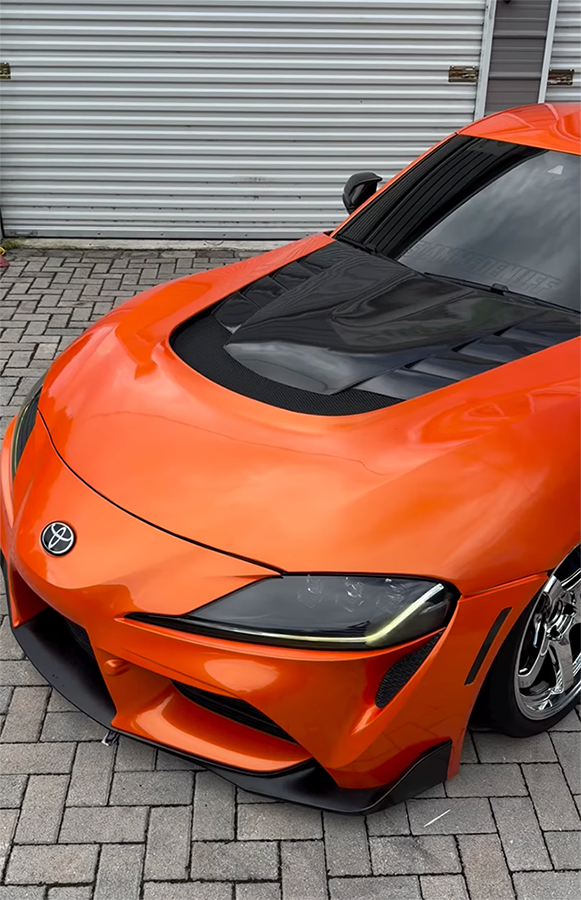 GalleryImage3 Close-up of a custom color change wrap being applied to a vehicle