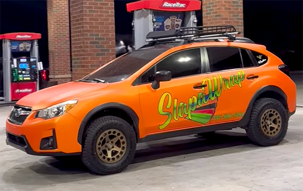 Vehicle wrap installation background showing professional wrap process