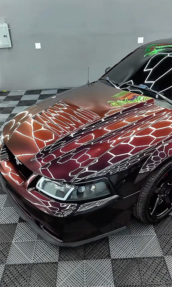 Close-up of expert applying a precision color change vehicle wrap Close-up of expert applying a precision color change vehicle wrap