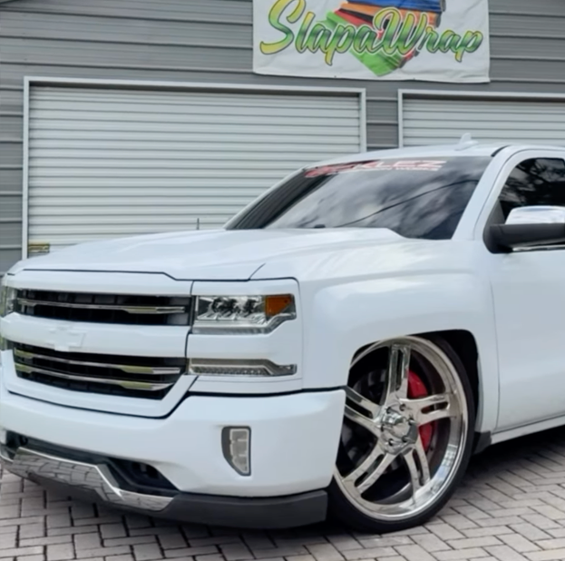 Close-up of a custom color change wrap being applied to a vehicle