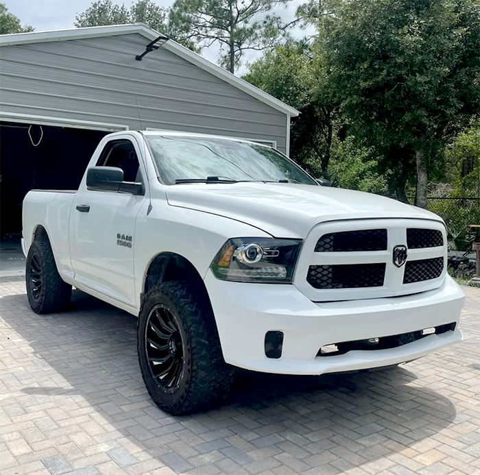 Ram Truck with Cheetah-Wrap Gloss White Grille & Bumpers Ram truck with grille, front bumper, and rear bumper wrapped in Cheetah-Wrap gloss white